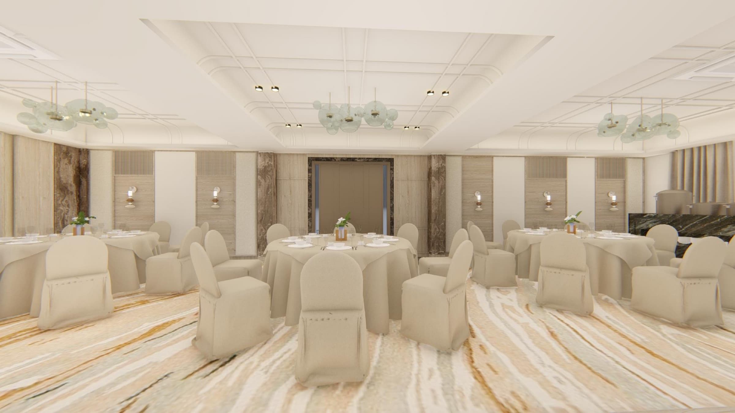 Banquet hall with round tables, cream seating and glass chandeliers